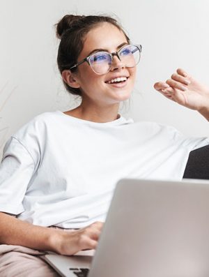 image-of-smiling-beautiful-woman-using-laptop-whil-QN9VYGM.jpg